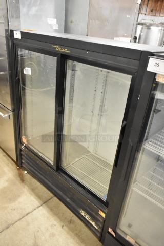 True GDM-41SL-54-LD commercial 2-door reach-in cooler, black metal frame, glass doors, poly coated racks, 115 volts, used.