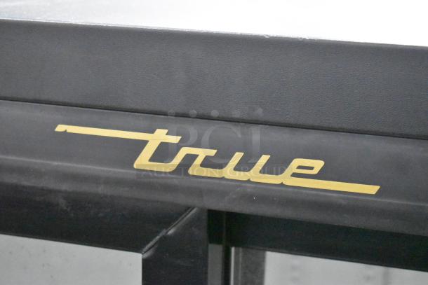 True GDM-41SL-54-LD commercial two-door cooler with poly-coated rack, 115V, 1 Phase. Visible True logo on metal exterior.