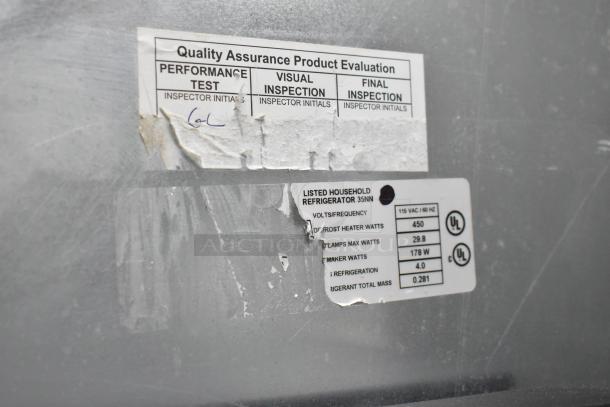 Viking stainless steel commercial reach-in cooler with freezer drawer. Features quality assurance labels and specifications for 115 volts, 1 phase.