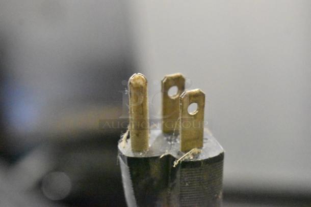 Close-up of a three-prong power plug, indicating compatibility with 100-120 volts, used for the Hobart HL200 mixer.