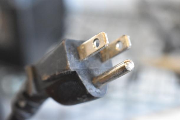 Close-up view of the power plug for a 2021 Vita-Mix VM0145 commercial blender.