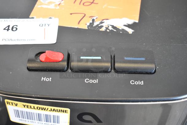 Avalon A23 floor water dispenser with hot, cool, and cold buttons. Features tags with auction and product info.