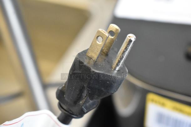 Close-up of a power plug for Avalon A23 Floor Style Water Dispenser, 115 volts, 1 phase. Plug shows standard three-prong design.