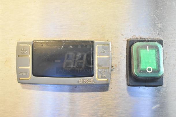 Close-up of Dixell digital control panel and power switch on 2019 Atosa MBF8001GR stainless steel commercial freezer.