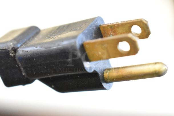 Close-up of a three-prong plug for the Asber APTP 46 Stainless Steel Commercial Pizza Prep Table, 115 Volts, 1 Phase.