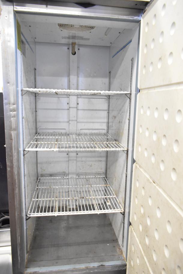 Arctic Air AF23Z stainless steel commercial freezer with poly-coated racks, single door, used, 115V, 1 phase, 3 shelves.