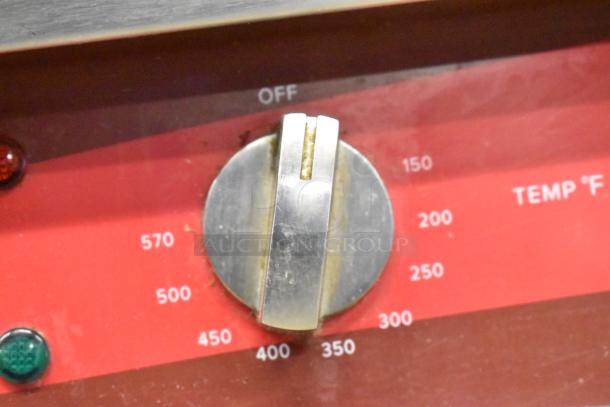 Avantco 177EG30N griddle temperature dial, shows Fahrenheit range 150-570, stainless steel knob, slight wear visible.
