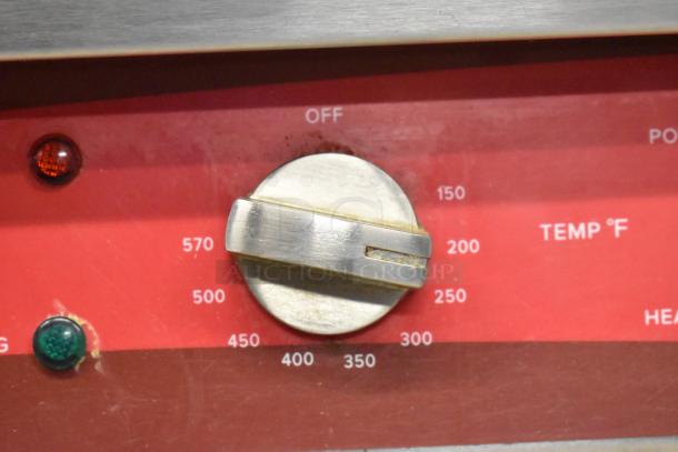 Avantco 177EG30N griddle temperature dial with range from 150°F to 570°F on a red panel. Knob shows wear.