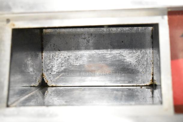 Avantco 177EG30N stainless steel electric griddle, 30" countertop model, used condition, interior view showing wear.