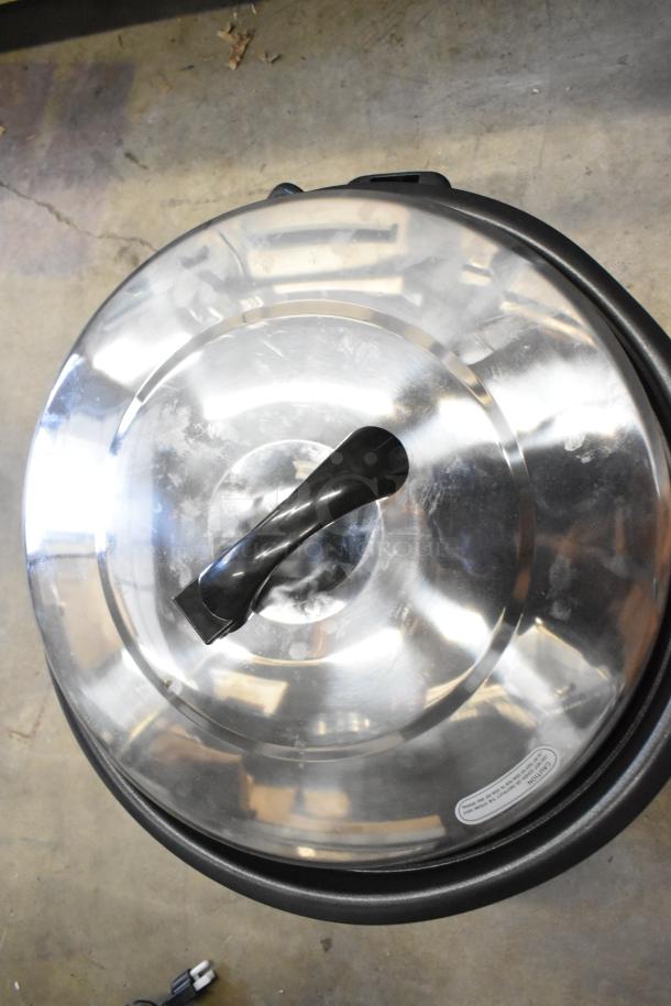 Avantco 177RCB124 stainless steel rice cooker with removable lid; minor scratches visible; 124 cup capacity, 120V, new condition.