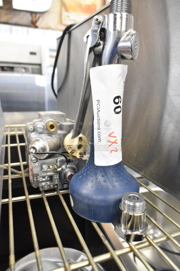 Brand new scratch and dent spray nozzle head and 82266 MM24179A unit with visible tags from PCIAuctions.com, item 60.