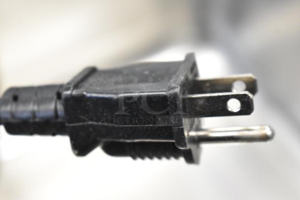 Close-up of a black 3-prong plug for the ServIt 423FW150 commercial countertop food warmer. Condition appears new.