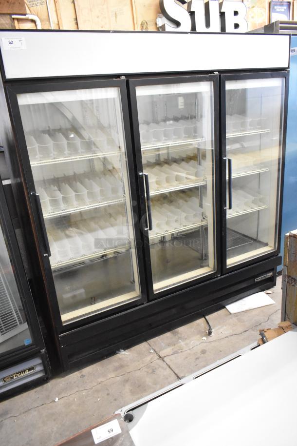 Beverage Air commercial 3-door reach-in cooler; metal frame, glass doors, poly-coated racks; 115 volts, 1 phase; good condition.