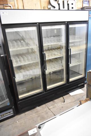 Beverage Air commercial 3-door reach-in cooler; metal frame, glass doors, poly-coated racks; 115 volts, 1 phase; good condition.
