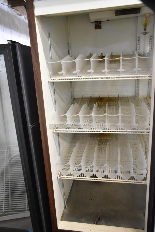 Beverage Air 3 Door Reach-In Cooler, metal exterior, poly coated racks, 115 volts, 1 phase, commercial use, interior view.