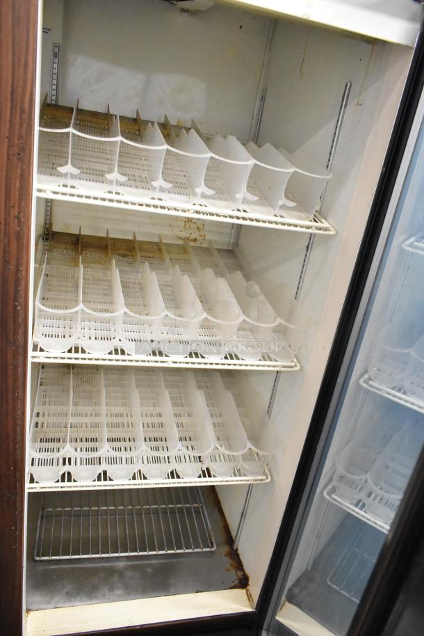 Beverage Air 3-door cooler merchandiser, poly-coated racks, 115V, 1 phase, interior signs of rust, used condition.