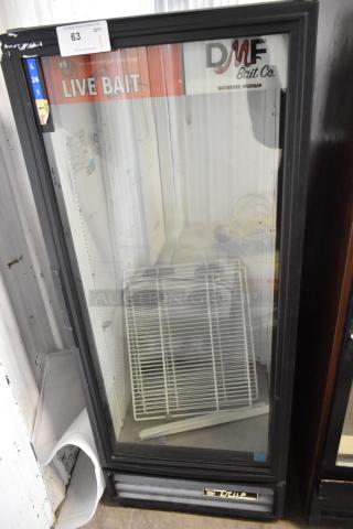 True GDM-12-LD single door merchandiser cooler, metal exterior, glass door, shelves inside, 115 volts, "DMF Bait Co." signage.