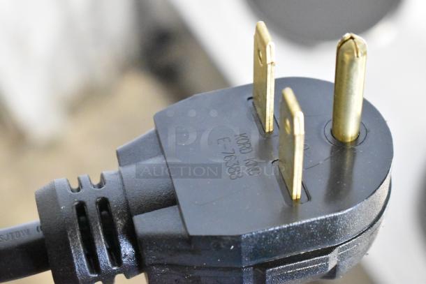 Close-up of a Kord King E76388 electrical plug for Nemco 6311-4-240 stainless steel commercial countertop hot plate.