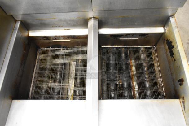 Royal RFT-50 stainless steel commercial fryer, propane gas-powered, 2-bay, used condition with visible wear.