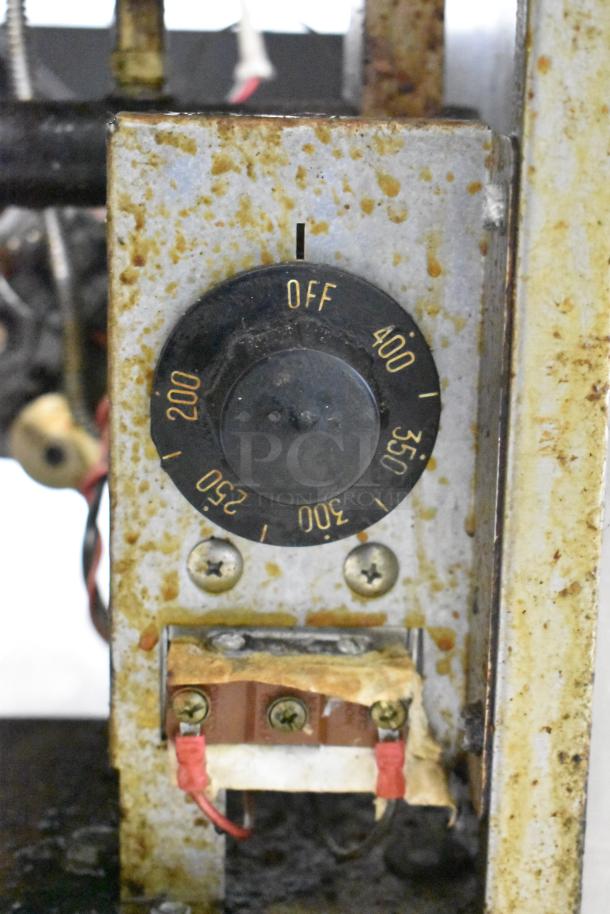 Royal RFT-50 fryer thermostat control showing temperature settings from 200°F to 400°F with visible rust and wear.