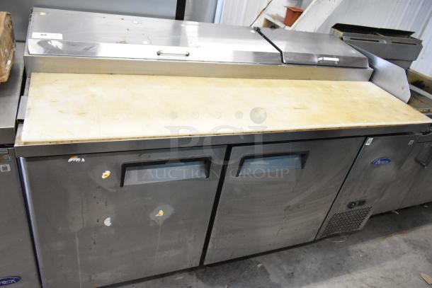 2018 Atosa MPF8202GR stainless steel pizza prep table, used, on commercial casters. Features two doors, 115V, 1 phase.