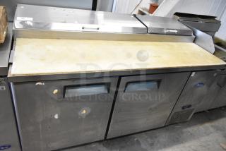 2018 Atosa MPF8202GR stainless steel pizza prep table, used, on commercial casters. Features two doors, 115V, 1 phase.