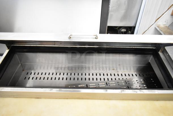 2018 Atosa MPF8202GR stainless steel pizza prep table with commercial casters, 115V, 1 phase, shown open.