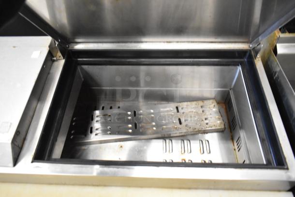 2018 Atosa MPF8202GR stainless steel commercial pizza prep table. Features include interior shelving and commercial casters.