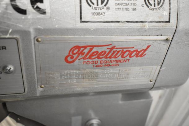Fleetwood AE-20A dough mixer label showing model, voltage, and certification details. Labels indicate commercial use.