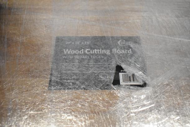Box containing 24" x 18" x 1 3/4" Choice wood cutting board with square edges, labeled and wrapped in plastic.