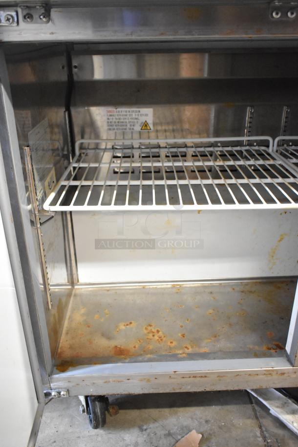 Atosa 178AU48FHC stainless steel 2-door undercounter freezer with caster wheels, visible rust and wear inside. 115V, 1 phase.