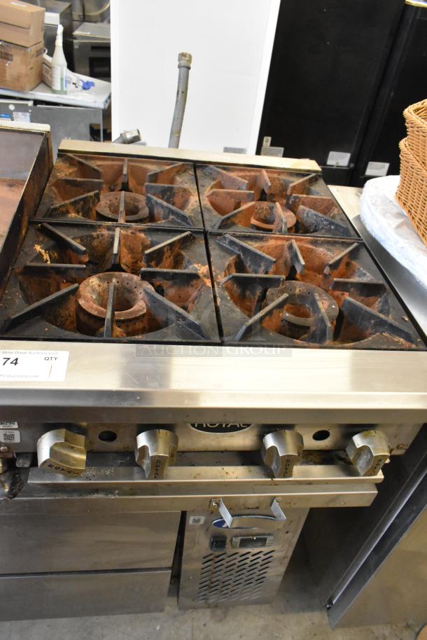 Royal RHP-24-4 stainless steel 4-burner propane gas range, 30,000 BTU, used condition with visible wear, control knobs labeled.