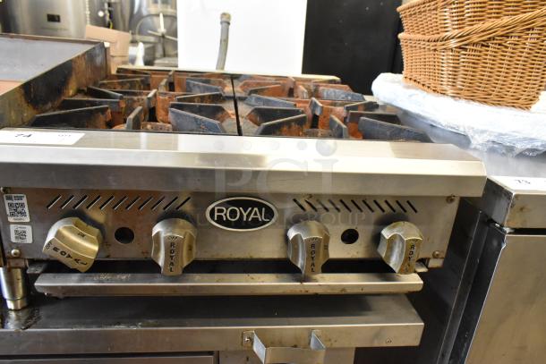 Royal RHP-24-4 stainless steel commercial propane range with 4 burners, 30,000 BTU, used condition, visible knobs and Royal logo.
