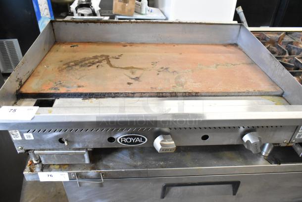 Royal Stainless Steel Commercial Countertop Gas Griddle, worn flat top surface, dual temperature controls, visible Royal logo.
