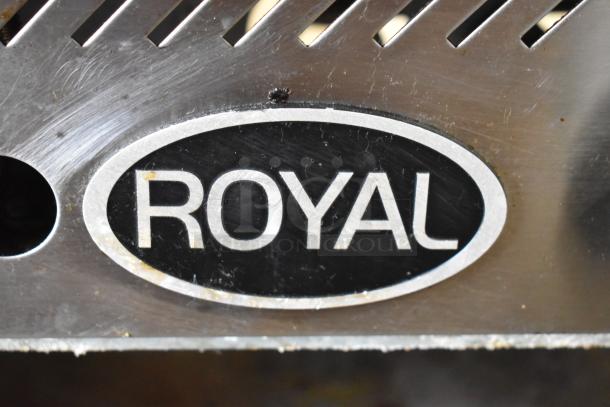 Royal stainless steel gas griddle with logo, commercial-grade, countertop model, slight wear visible, durable build.