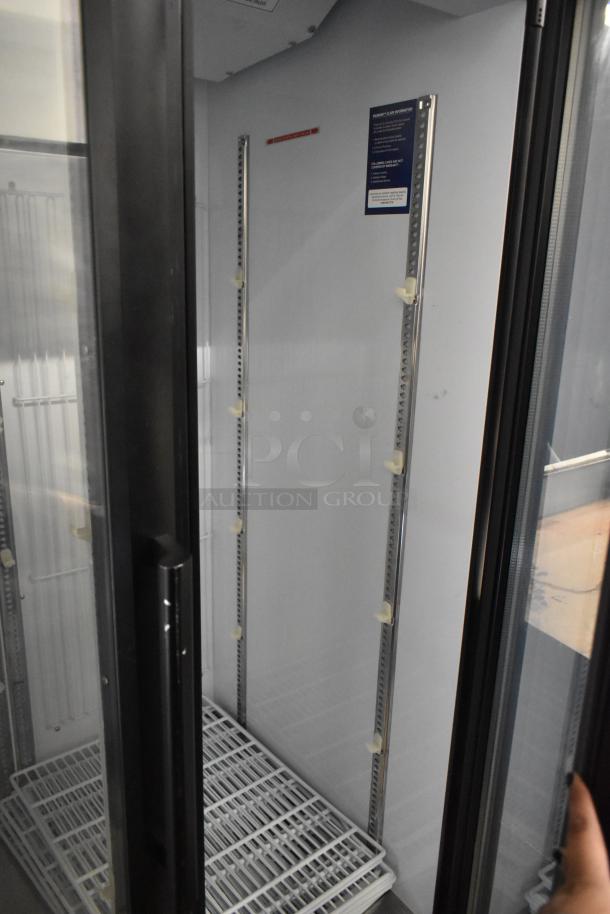 Turbo Air TGF-35SDB-N commercial 2-door reach-in freezer with poly-coated racks, 115 volts, 1 phase, clean interior.
