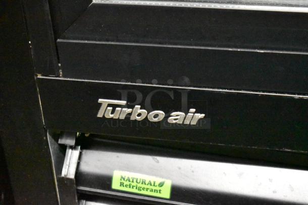 Turbo Air TGM-48RB-N commercial cooler with metal frame and poly coated racks. Features "Turbo Air" and "Natural Refrigerant" labels.