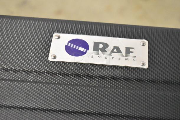 Rae Systems hard case, black with textured finish, metal logo plate on top, durable construction, excellent condition.