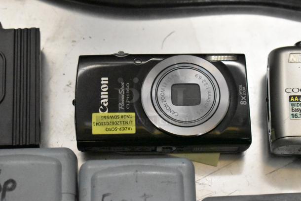 Canon PowerShot ELPH 160 digital camera, black, 8x optical zoom, lightly used with visible marking tag and label details.