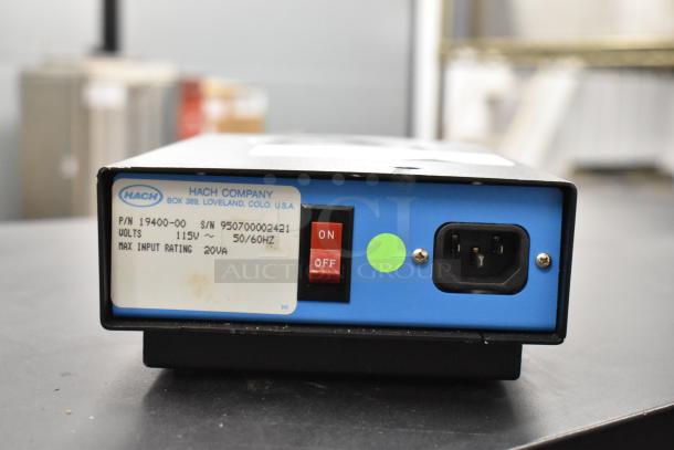 Hach TitraStir Stir Plate, 115V, 1 Phase, with on/off switch and power input. Serial label visible. Good condition.