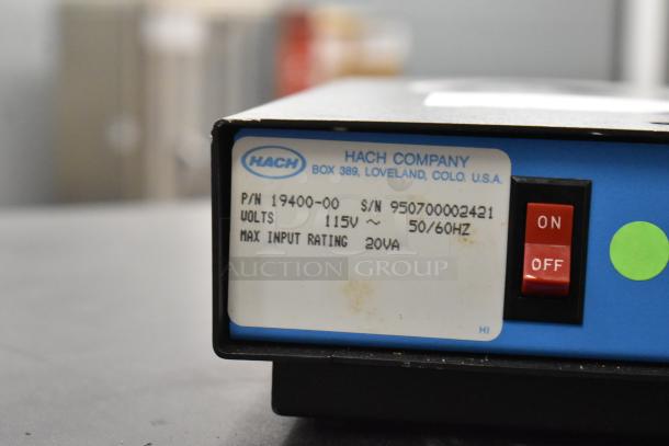 Hach TitraStir Stir Plate with 115V power, on/off switch, and label indicating model and voltage.