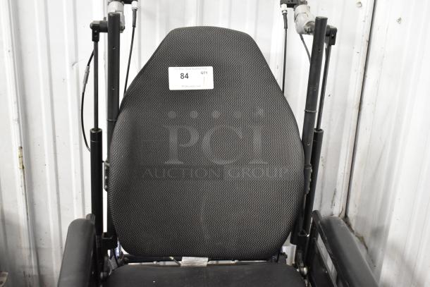 Comfort Ascent Wheelchair, black cushioned backrest, metal frame, condition good, auction tag reads 84.