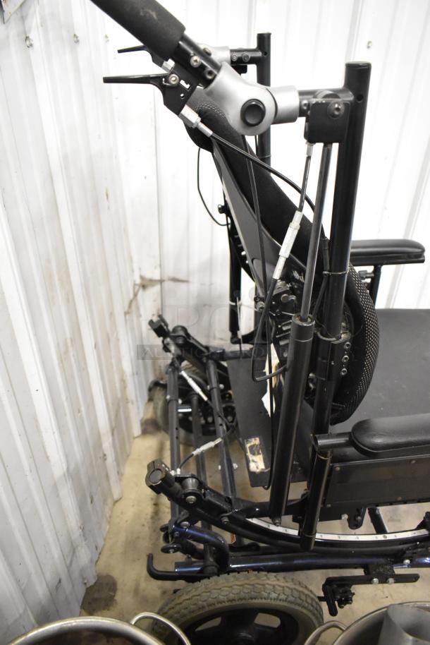 Comfort Ascent Wheelchair, black frame, ergonomic design, sturdy build, adjustable components, good condition.