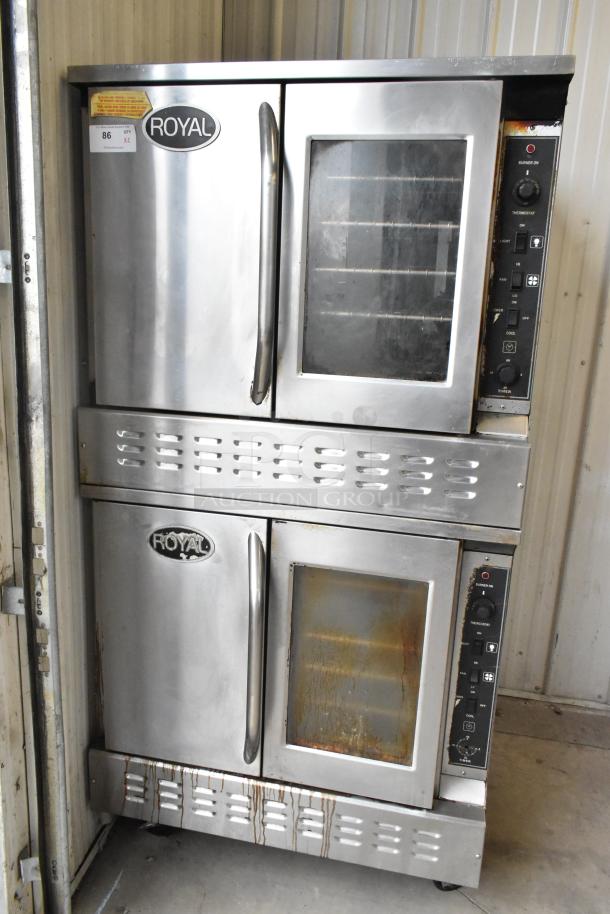 Royal RCOD-1 stainless steel convection ovens, natural gas, view-through and solid door, metal racks, on casters.