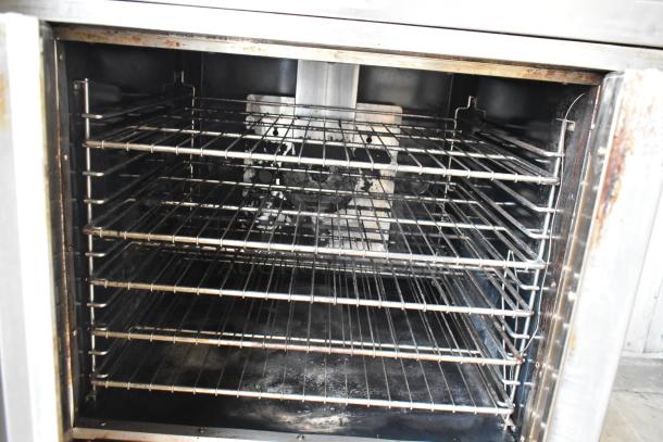 Royal RCOD-1 convection oven interior with metal racks. Stainless steel, natural gas powered, view-through door.