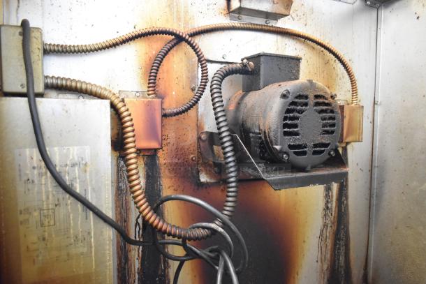 Close-up of internal components of Royal RCOD-1 convection oven, showing wiring and motor, indicating wear and use.