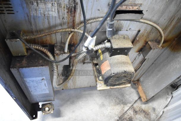 Back of Royal RCOD-1 convection oven showing electrical components, wiring, and fan motor. Appears worn and dusty.