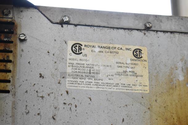 Royal RCOD-1 label detailing model specs and CSA certification. Shows natural gas use, BTU details, and sanitation info.