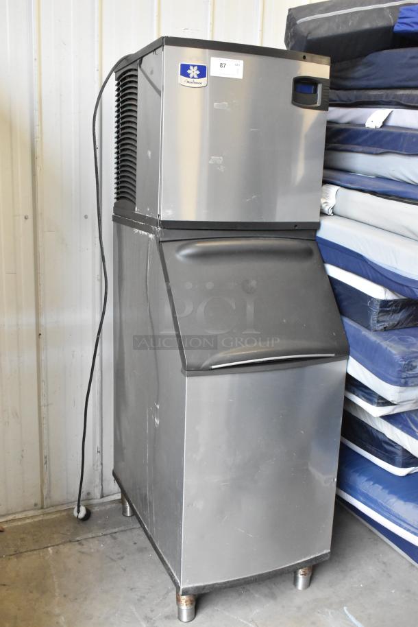 Manitowoc IY0524A-161 stainless steel ice machine head on bin, 115V, 1 phase, in good condition, commercial use.