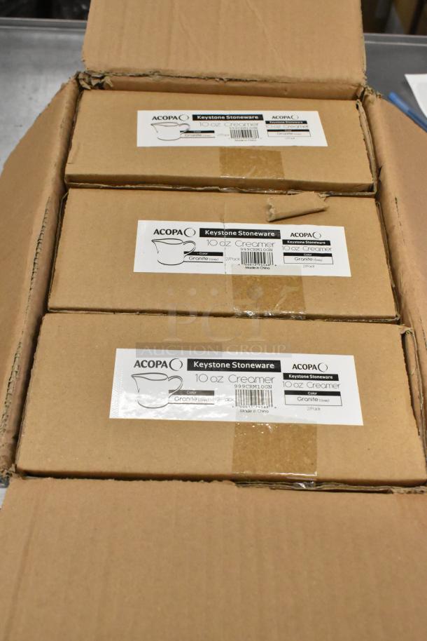 Acopa Keystone 10 oz. Granite Gray Stoneware Creamers in boxes, labeled, showing 12 per case, new condition.